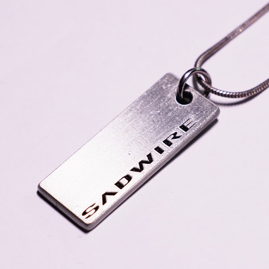 "STEEL CAGE" TAG NECKLACE